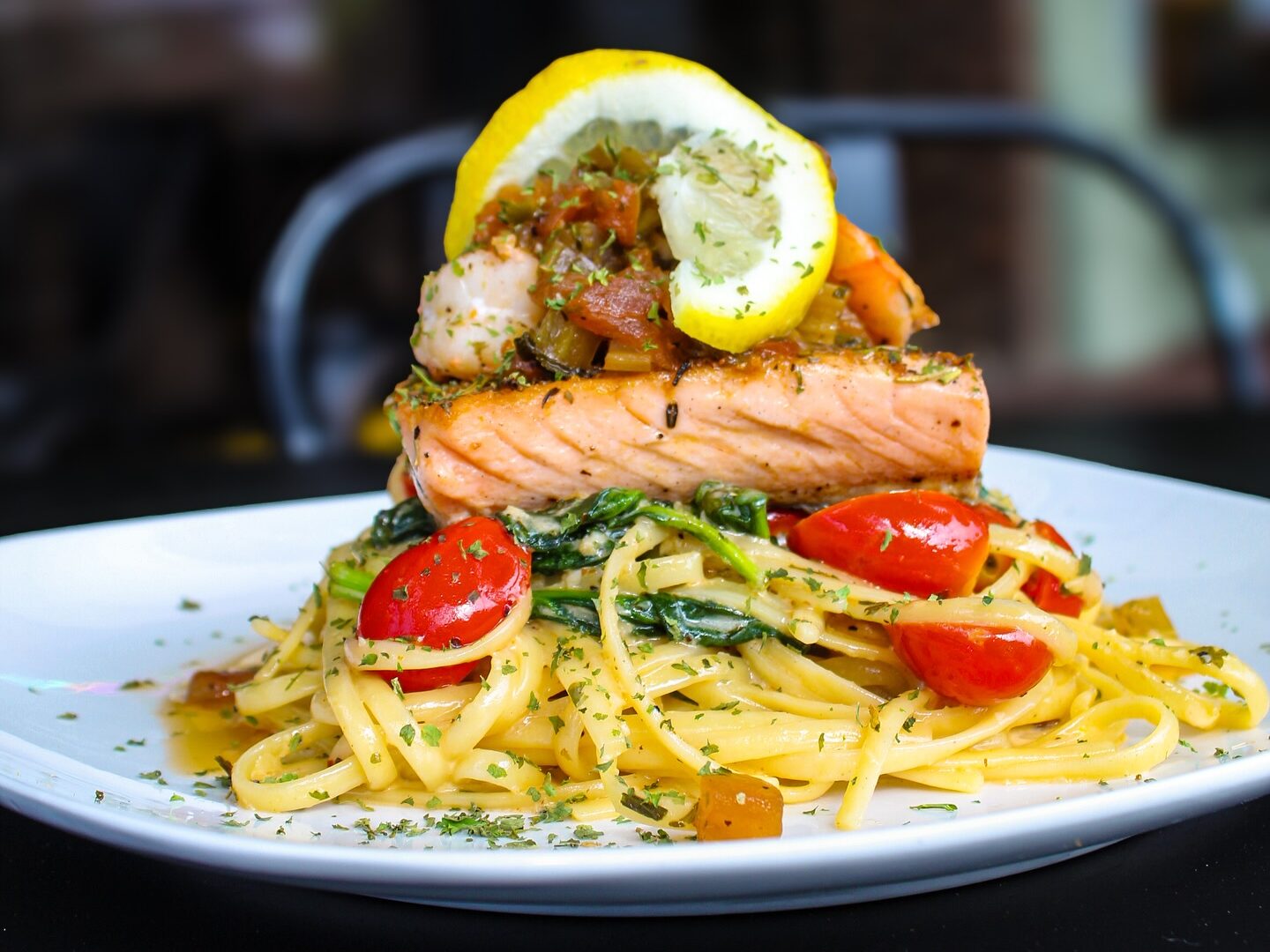 Salmon and pasta dinner plate served at Sanctuary on the Square